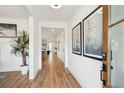 Bright entryway with hardwood floors, leading to the living area at 780 Opal Wing St, Moncks Corner, SC 29461