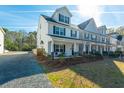 Two story home with front porch and landscaping at 8202 S Antler Dr, North Charleston, SC 29406