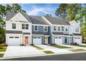 New townhomes featuring various exterior colors and attached garages at 1077 Crescent Cove Ln, Summerville, SC 29483
