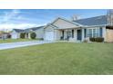Houses with green lawns and driveways at 124 Pointer Dr, Goose Creek, SC 29445