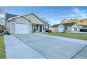 Houses with driveways and green lawns at 124 Pointer Dr, Goose Creek, SC 29445