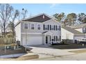 Two-story house with gray siding, dark brown accents, and a two-car garage at 145 Clydesdale Cir, Summerville, SC 29486