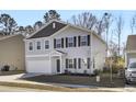 Two-story house with gray siding, dark brown accents, and a two-car garage at 145 Clydesdale Cir, Summerville, SC 29486