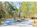 The picturesque entrance to The Preserve community, featuring a tree-lined drive at 1604 John Fenwick Ln, Johns Island, SC 29455