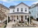 Two-story white house with a gray roof and a covered porch at 2021 Codorus Ln, Hanahan, SC 29410