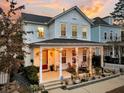 Two-story white house with a gray roof and a covered porch at 2021 Codorus Ln, Hanahan, SC 29410