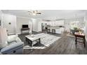 Spacious living room with hardwood floors, light walls, and comfortable furniture at 326 Turner Ln, Round O, SC 29474
