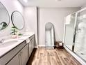 Main bathroom with double vanity, large mirror, and walk-in shower at 343 Lake Ridge Blvd, Summerville, SC 29483