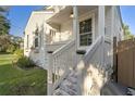 Quaint front porch with white railings and brick steps at 4 Hester St, Charleston, SC 29403