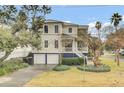 Beautiful two-story home with a two-car garage and landscaped yard at 4000 Cameron Blvd, Isle of Palms, SC 29451