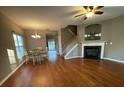 Living room features hardwood floors, a fireplace, and access to the dining area at 406 Chinquapin Dr, Summerville, SC 29485