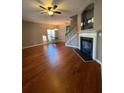 Hardwood floors, fireplace, and an open floor plan to the dining area at 406 Chinquapin Dr, Summerville, SC 29485