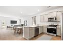 Open-concept kitchen with stainless steel appliances and island at 104 River Hill Rd, Goose Creek, SC 29445