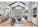 Spacious living room with high ceilings, fireplace, and hardwood floors at 1484 Old Rosebud Trl, Awendaw, SC 29429