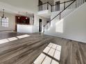 Two-story living room with hardwood floors and open concept at 158 Mayfield Dr, Goose Creek, SC 29445