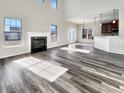 Spacious living room with hardwood floors, fireplace, and large windows at 158 Mayfield Dr, Goose Creek, SC 29445
