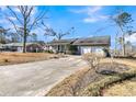 Ranch home with a long driveway and mature trees at 211 Brailsford Rd, Summerville, SC 29485