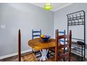 Small dining area with wooden table and blue chairs at 219 Sea Cloud Cir, Edisto Island, SC 29438