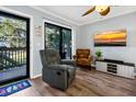 Relaxing living room with recliner and access to patio at 219 Sea Cloud Cir, Edisto Island, SC 29438