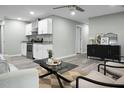 Open living room featuring a neutral color palette, stylish furniture, and hardwood floors at 2334 Falcon Rd, North Charleston, SC 29406