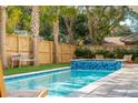 Relaxing backyard oasis with a beautiful pool and wooden fence at 2606 Cameron Blvd, Isle of Palms, SC 29451