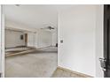 Large living room with worn carpet and ceiling fan at 2736 Bonds Ave, North Charleston, SC 29405