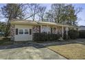 Brick ranch house with carport and landscaping at 303 Holly Avenue Ave, Goose Creek, SC 29445