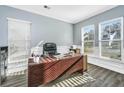Home office with a large desk, comfortable chair, and plenty of natural light at 394 Sanctuary Park Dr, Summerville, SC 29486