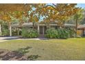 House exterior showcasing landscaping and a brick walkway at 428 Howle Ave, Charleston, SC 29412