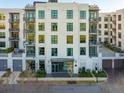 Modern building exterior with multiple entrances and landscaping at 5 Gadsdenboro St # 515, Charleston, SC 29401