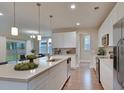 Modern kitchen featuring white cabinets, large island, and stainless steel appliances at 8623 Connor Ct, North Charleston, SC 29406
