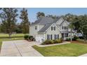 Two-story house with a three-car garage and a long driveway at 113 History Ln, Summerville, SC 29485