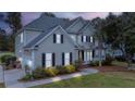 Two-story house with a three-car garage, and front yard lighting at 113 History Ln, Summerville, SC 29485