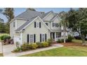 Two-story house with a three-car garage and neatly landscaped yard at 113 History Ln, Summerville, SC 29485