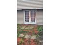 Back exterior with double doors and patio at 1150 King St, Charleston, SC 29403