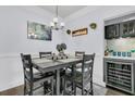Charming dining area with built-in bar and wine cooler at 1300 Park West Blvd # 417, Mount Pleasant, SC 29466