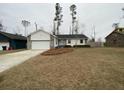 House exterior featuring a two-car garage and landscaping at 148 Ponderosa Dr, Ladson, SC 29456