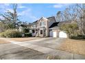 Two-story home with a two-car garage and landscaped yard at 151 Belleplaine Dr, Goose Creek, SC 29445