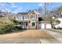Two story brick home with attached garage and mature trees at 151 Belleplaine Dr, Goose Creek, SC 29445