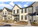 Cream and gray two-story townhouses with front porches and landscaping at 157 Pocket Bend Cir # B, Summerville, SC 29486