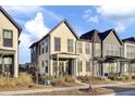 Cream and gray two-story townhouses with front porches and landscaping at 157 Pocket Bend Cir # B, Summerville, SC 29486
