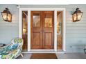 Elegant front entrance with a large wood door and sidelights at 2256 Ion Ave, Sullivans Island, SC 29482