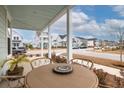 Relaxing front porch with table and chairs, perfect for outdoor dining at 229 Symphony Ave, Summerville, SC 29486
