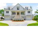 White two-story home with metal roof, and a large front porch at 3908 Delinger Dr, Mount Pleasant, SC 29466
