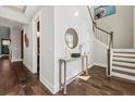 Bright entryway with hardwood floors and elegant staircase at 3913 Maidstone Dr, Mount Pleasant, SC 29466