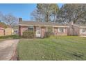 Brick ranch home with front yard at 4 Ferncliff Way, Goose Creek, SC 29445