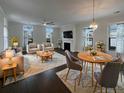 Spacious living room with hardwood floors, fireplace, and ample natural light at 4140 Home Town Ln, Ravenel, SC 29470