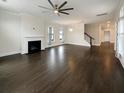 Large living room featuring hardwood floors and a fireplace at 4140 Home Town Ln, Ravenel, SC 29470