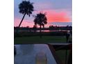 Relaxing sunset view from a deck, glass of wine present at 4960 Lambs Rd, North Charleston, SC 29418