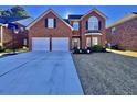 Brick two-story house with a two-car garage and a basketball goal at 8731 Evangeline Dr, North Charleston, SC 29420